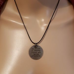 Antiqued faraway adventures message on black cord